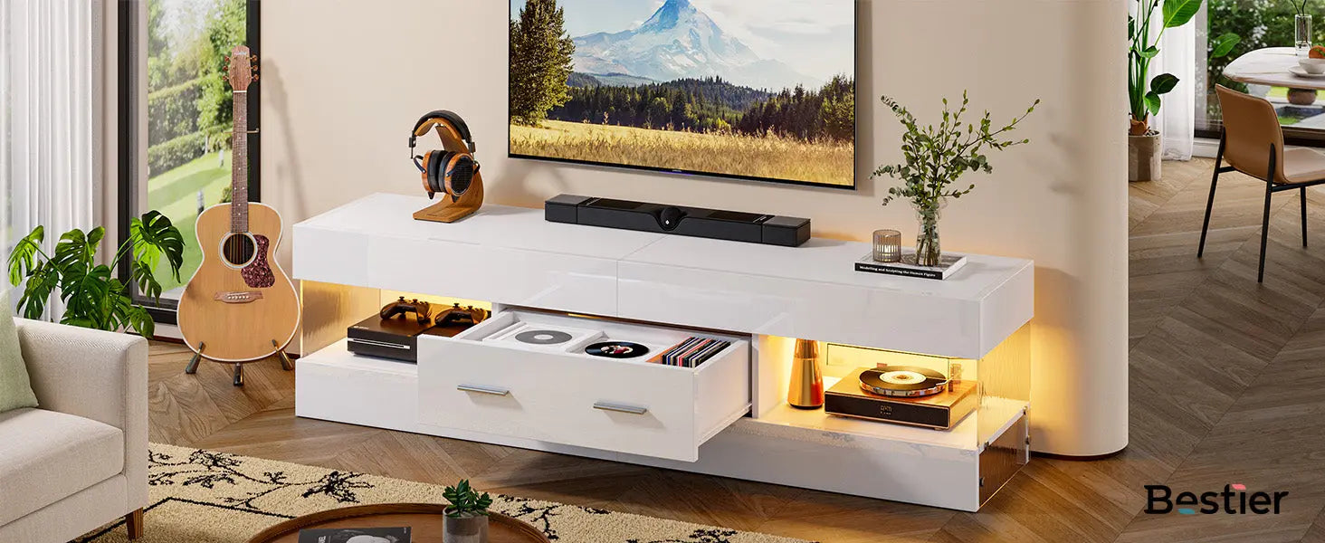Modern high-gloss white TV stand with warm LED lighting featuring a spacious drawer and open media storage shelves.