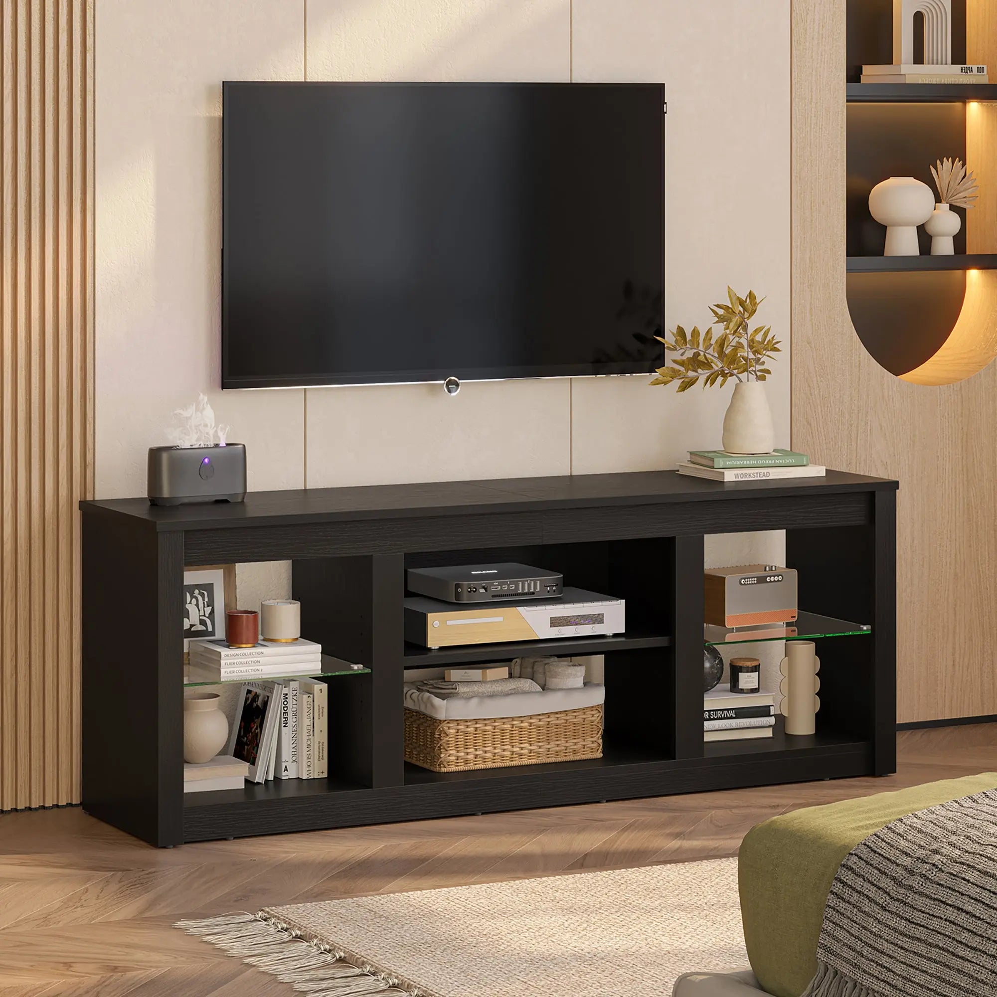 Black Bestier TV stand with storage shelves, decor, and electronics. Fits TVs up to 70".
