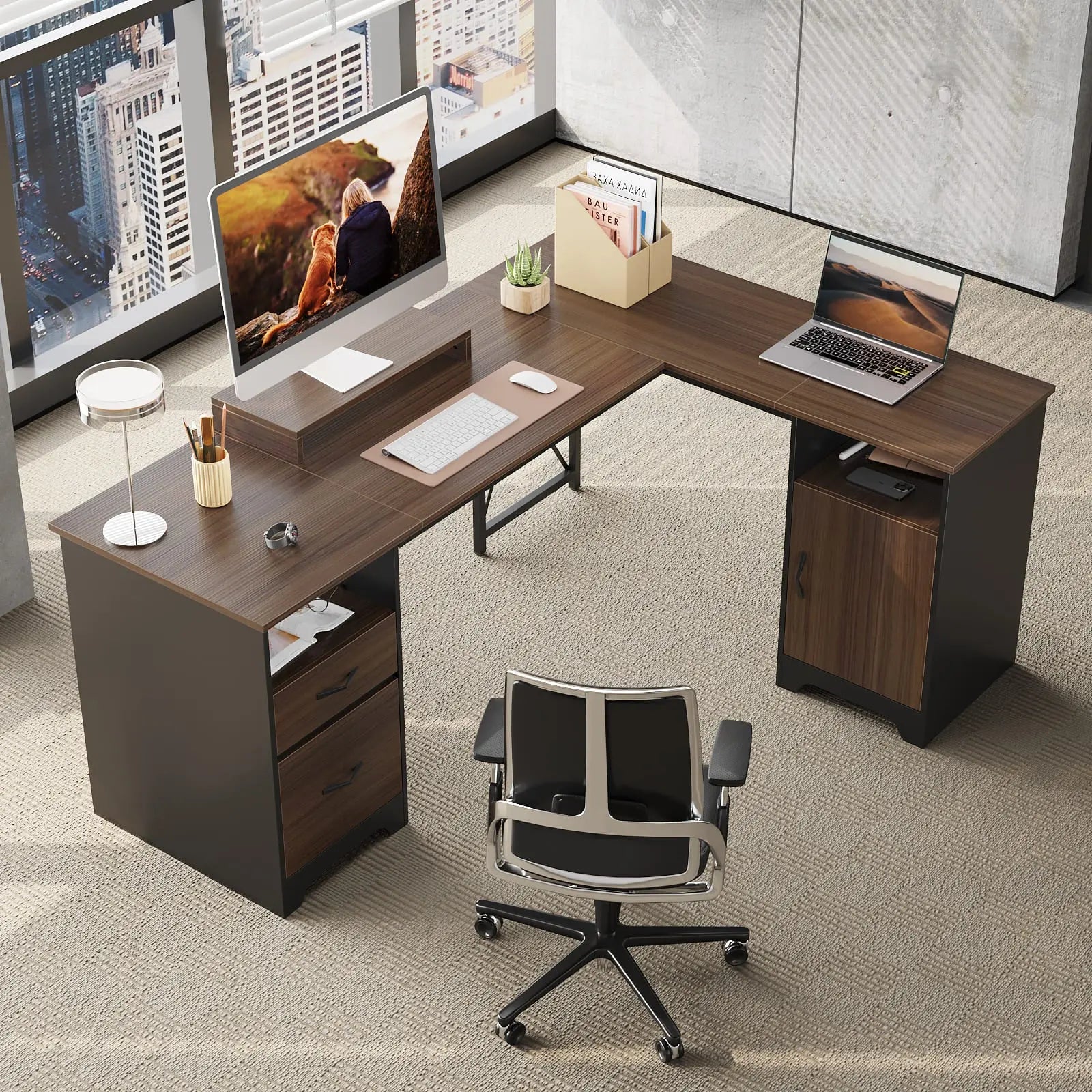 some computers on this l shaped desk with file drawers
