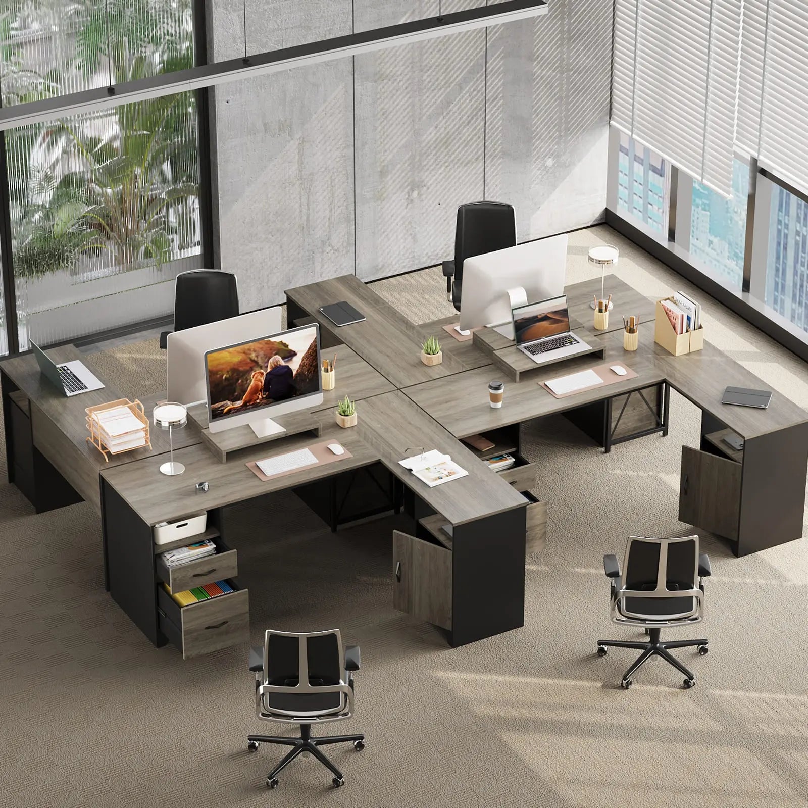 some gray l shaped desks with file drawers in the office