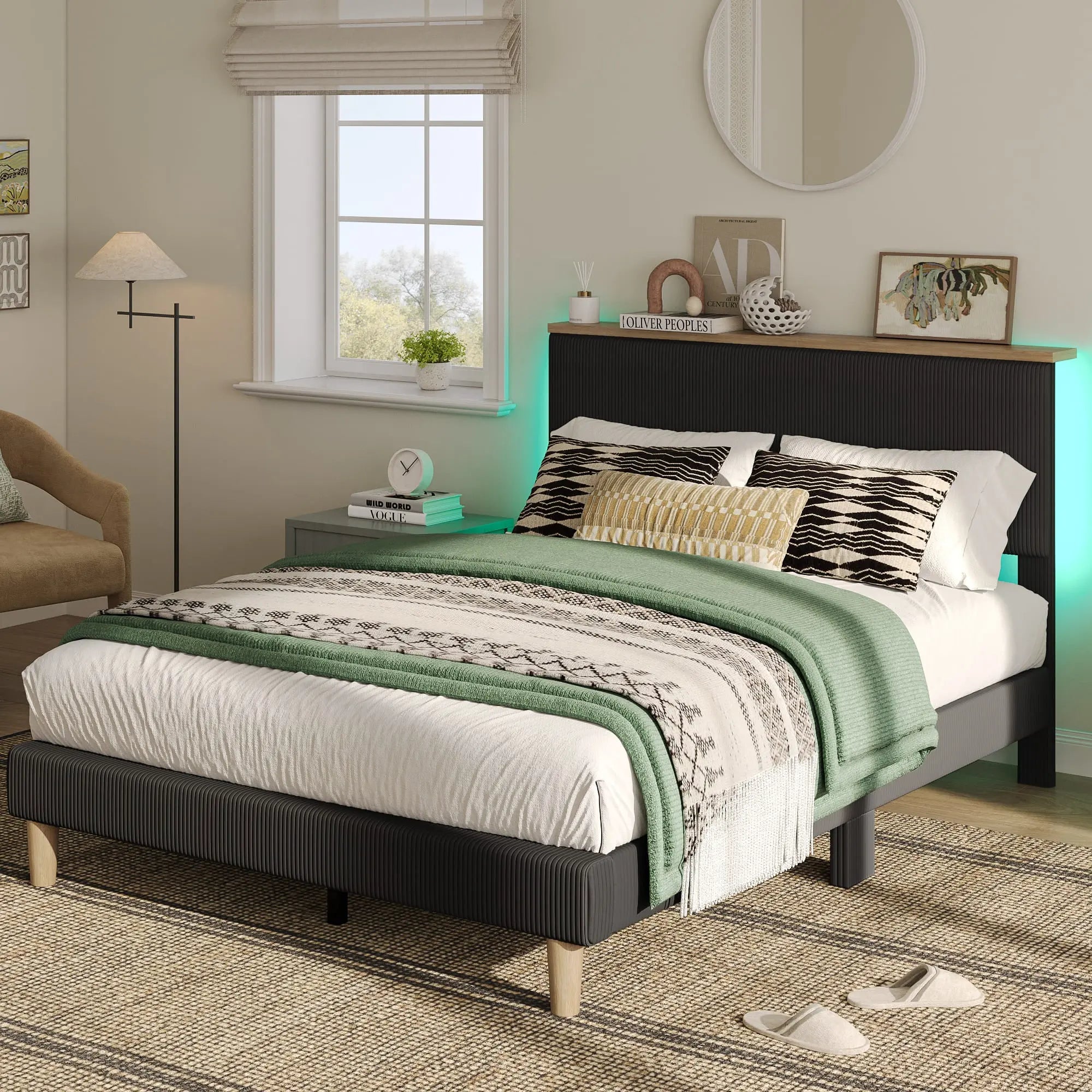 the black queen size bed frame with headboard in a bedroom