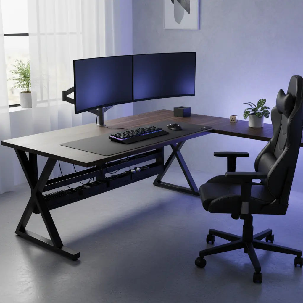 Professional gaming setup with dual curved monitors on a sturdy L-shaped desk, featuring gaming peripherals and clean cable management