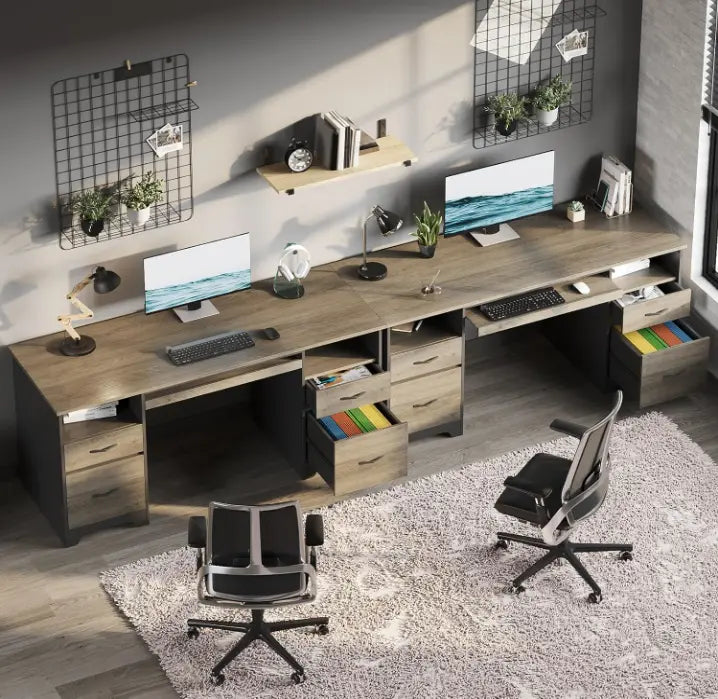 there are two gray computer desks in a room