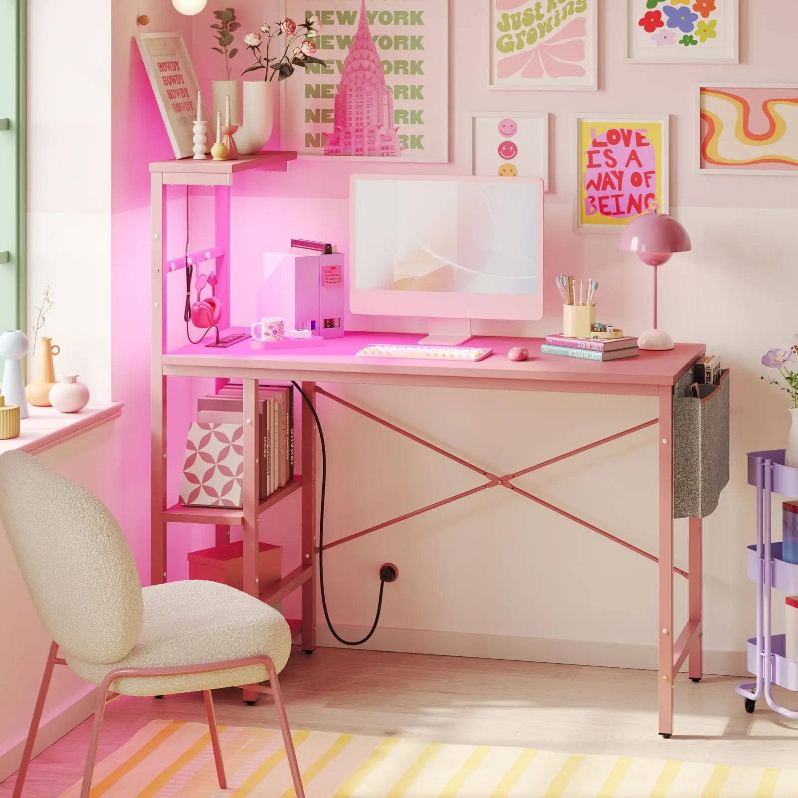 pink gaming desk with power oulets in a room